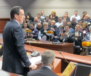 Malloy addresses business