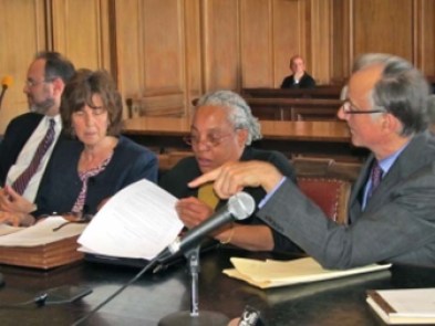 Elizabeth Horton Sheff leafs through last year's one-year agreement.