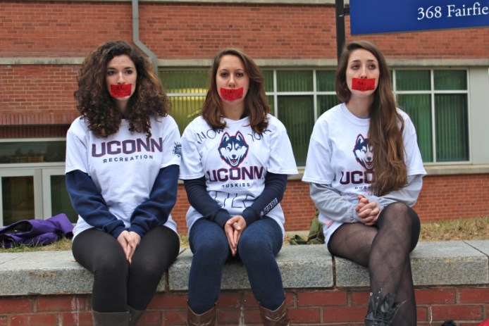 During Wednesday's rally, three students who have filed a complaint against UConn for its handling of sexual assaults show their views.