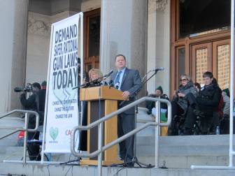Sen. John P. McKinney at a gun control rally after Newtown.