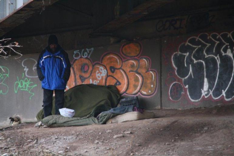 Sleeping arrangements for a homeless man under 84-East in Hartford. 