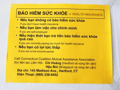 A notice about getting health insurance in Vietnamese at the Connecticut Coalition of Mutual Assistance Association’s Hartford office.