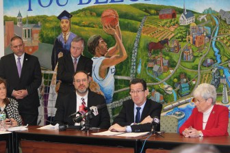 Gov. Dannel P. Malloy, flanked by his education commissioner and House Democratic leaders, thanks the panel overseeing teacher evaluations for making changes to its rollout