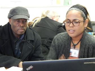 Eva Bermudez, an organizer with the union CSEA, helped Maxime Calixte sign up for health insurance last year.