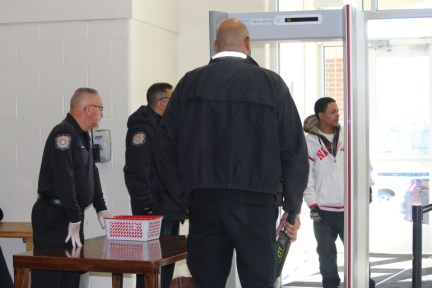 Security guards at Wilbur Cross in New Haven greet a visitor