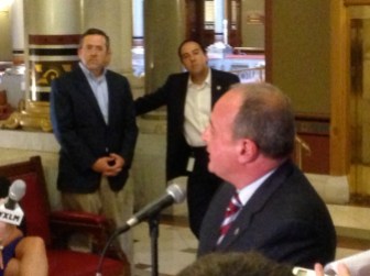 George Gallo, center, watching Rep. Lawrence F. Cafero Jr. announce he would not run for governor.