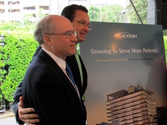 Gov. Dannel P. Malloy with Dr. Leonard Bell, the founder and CEO of Alexion as the governor promised up to $51 million in state assistance to the company in 2012.