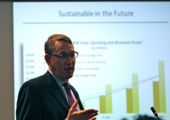 Ben Barnes, the governor's budget chief, presents the budget