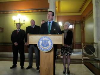Gov. Dannel P. Malloy decries Metro-North's unreliability. From left, Joseph Giuliett, Thomas Prendergast and Lt. Gov. Nancy Wyman.