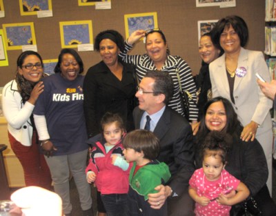 Gov. Malloy with day care providers and children they care for during an announcement in January on a contract that would give them a 3 to 8.25 percent raise.