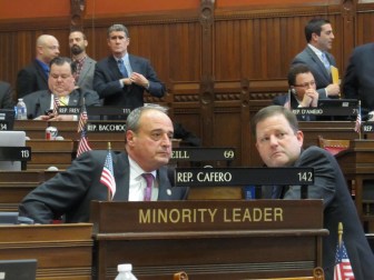 Rep. Lawrence F. Cafero Jr, left, and Sen. John P. McKinney, the GOP leaders, consult during the minimum wage debate.