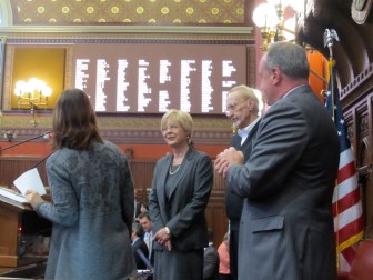 Tami Zawistowski after taking oath from Secretary of the State Denise Merrill. At right,  her husband, Ed, and Rep. Lawrence F. Cafero Jr.