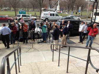 The media awaits a former governor after his arraignment.