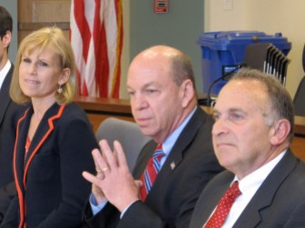 Mike Clark, seated between Lisa Wilson-Foley and Mark Greenberg at a debate in 2012.