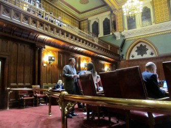 Sen. John P. McKinney talking to Sen. Gayle Slossberg.
