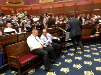 House Majority Leader Joseph Aresimowicz huddles Thursday with his GOP counterpart, Lawrence F. Cafero.