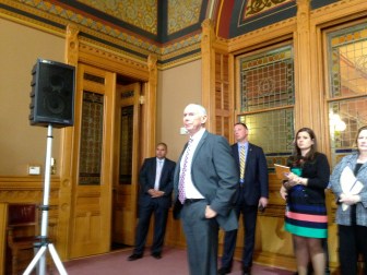 Mark Ojakia, the governor's chief of staff, watching Malloy's performance Friday.