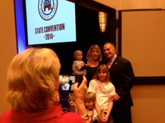 Mark Greenberg posing with his family as the votes were counted.
