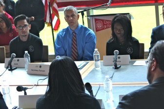 U.S. Education Secretary Arne Duncan listens to students at a Hartford magnet school. 