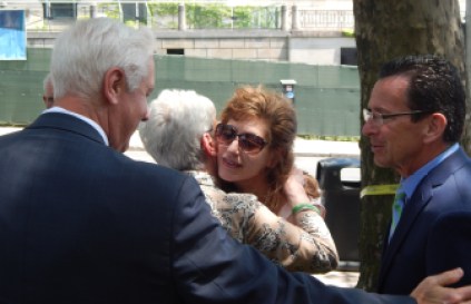 UConn Trustee Tom Ritter (left to right), Lt. Gov. Nancy Wyman, UConn President Susan Herbst and Gov. Dannel P. Malloy celebrate the finalizing of plans to reopen a branch campus in Hartford.