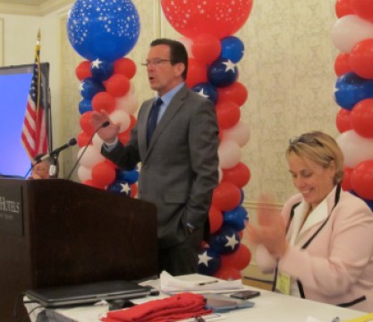 AFL-CIO leader Lori Pelletier applauds Gov. Dannel P. Malloy.