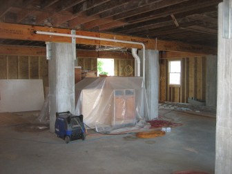 Nearly three dozen reinforced poured concrete posts now hold up Paula Brown's Branford home on Long Island Sound which flooded during storm Sandy. Steel braces connect the posts to new wider beams, but little else has been done to prevent wind damage.