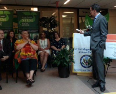 Gov. Dannel P. Malloy. At left are Mark Waxenberg and Melodie Peters, leaders of teachers' unions.