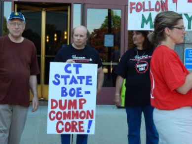 Protesters urge the state Board of Education to eliminate the Common Core State Standards outside the Legislative Office Building in Hartford July 9.