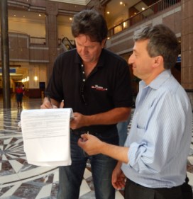 Joe Visconti signs Jonathan Pelto's petition for a spot on the November ballot for governor. Pelto later signed Visconti's petition.