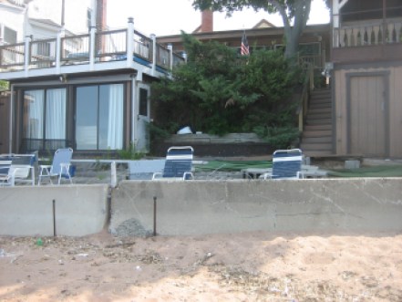 David Kronberg's home on Morris Cove in New Haven still has unrepaired damage from Storm Sandy nearly two years ago. The city has been approved for nearly $2 million in federal Sandy funding to build a seawall where temporary Jersey barriers are now. But it will be a race against the clock to meet the time limit on those funds.