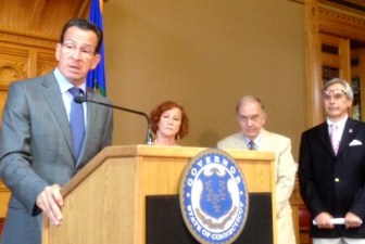 Gov. Dannel P. Malloy, Christine Palm, Sen. Martin Looney and Rep. Peter Tercyak.