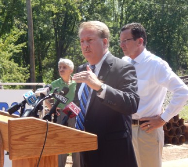 Rep. David Scriber, R-Brookfield, joins Gov. Dannel P. Malloy (right background) iin Rocky Hill to tout a state bridge repair program.