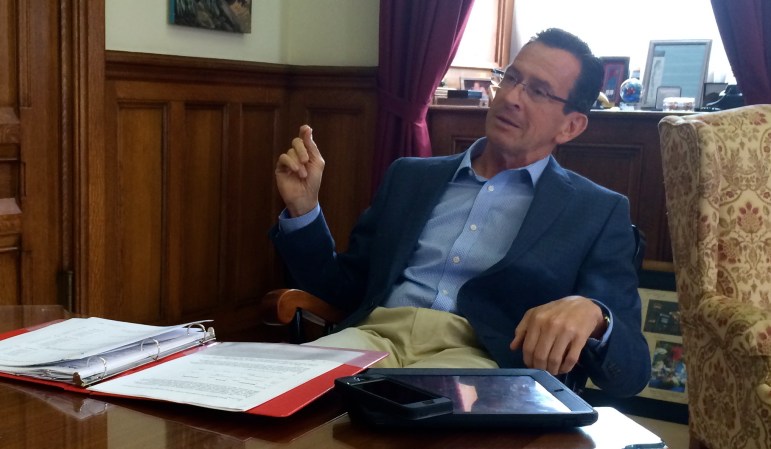 Dan Malloy at his desk  july 2014
