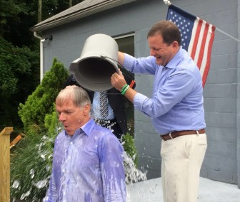 John P. McKinney douses  Foley after the day after the GOP primary as part of the ALS ice bucket challenge.