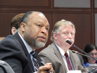 This is a photo of DSS Commissioner Roderick L. Bremby and George Chamberlin, who runs the benefits centers