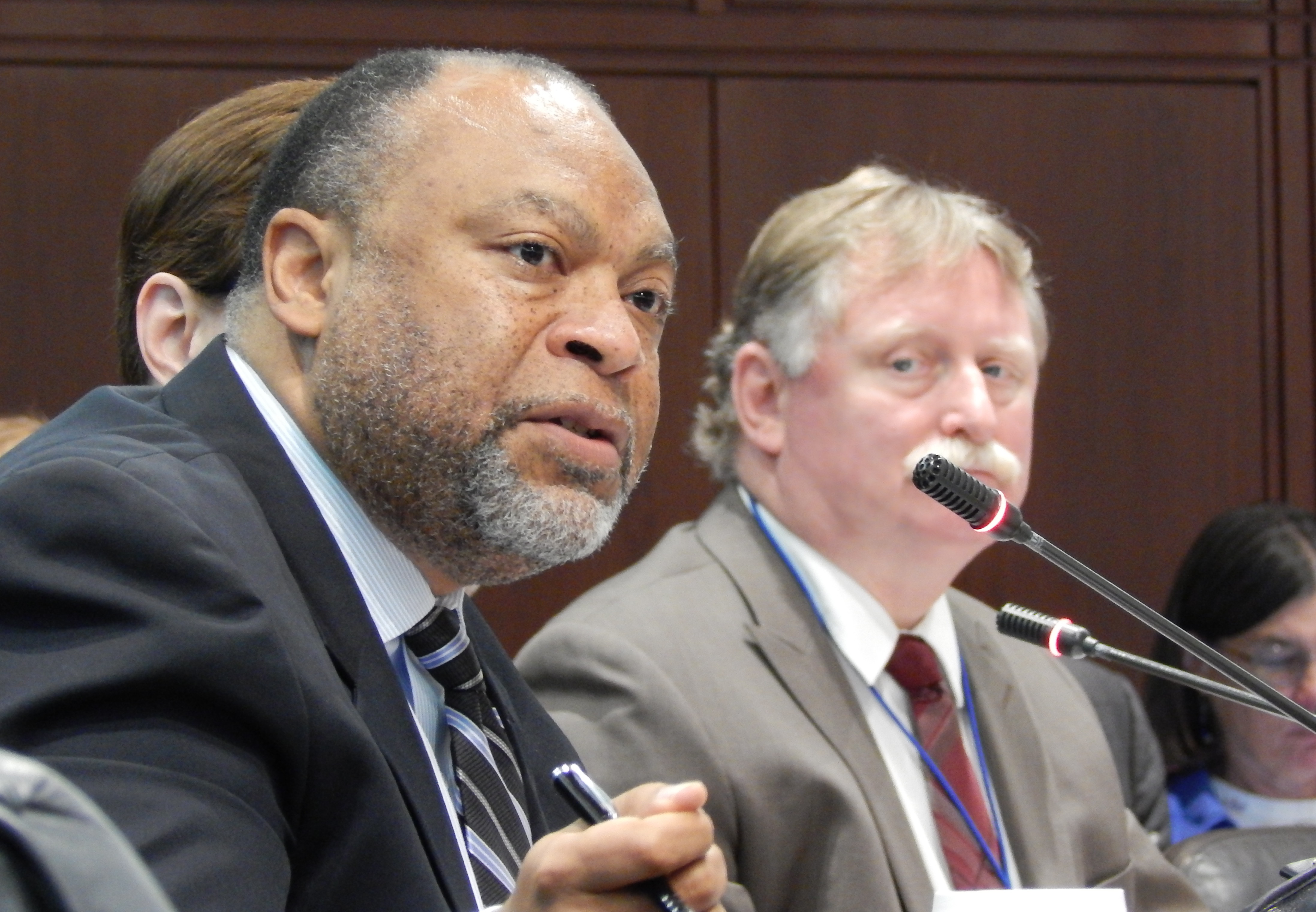 This is a photo of DSS Commissioner Roderick L. Bremby and George Chamberlin, who runs the benefits centers