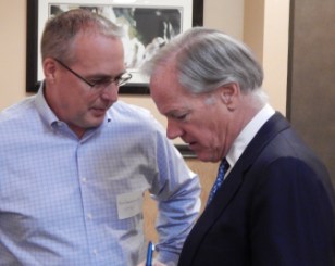 GOP gubernatorial candidate Tom Foley talks with Robert Hammersley, program manager for the former state Transportation Strategy Board.