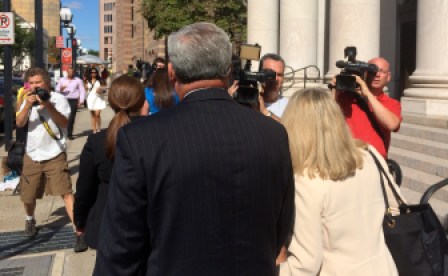 Rowland his wife, Patty, face the cameras at day's end.