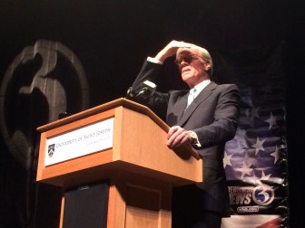 Tom Foley looks into the lights during the sound check