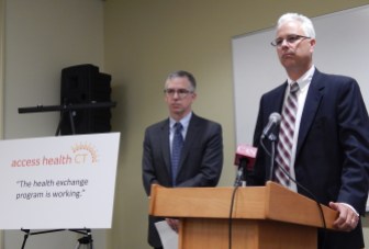 Access Health CEO Jim Wadleigh (left), Chris Barnes of The Pert Group, and a talking point