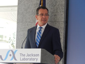 Gov. Dannel P. Malloy addresses the crowd moments before the official opening of the new genomic medicine research institute in Farmington
