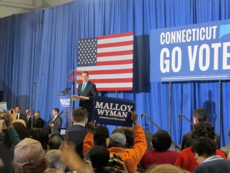 Malloy at a rally headlined by Michelle Oama.