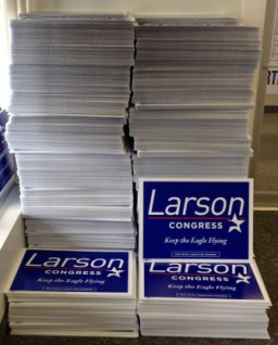This huge stack of lawn signs is n indication of Larson's enormous political war chest and campaigning power.