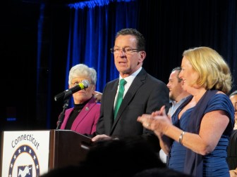 Malloy declaring victory. His wife, Cathy, applauds.