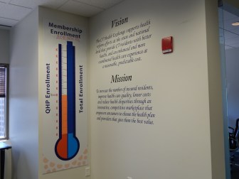 Access Health CT, the state's health insurance exchange, tracks enrollment on a sign in its lobby. In preparation of the next round of open enrollment, the tracker is back to zero.