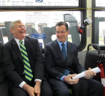 Gov. Dannel P. Malloy and   Transportation Commissioner James Redeker share a laugh at start of CT fastrak tour.