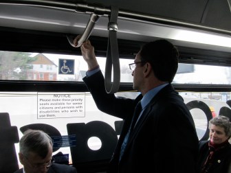 Strap-hanger-in-chief Dannel P. Malloy checks the view passing through Hartford.