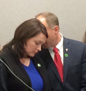 Nicole Hockley and Mark Barden, two Sandy Hook parents, share a moment Monday.