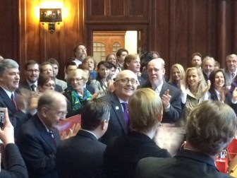 Sen. Andrew Maynard, D-Stonington, acknowledges applause on his return to the Senate.