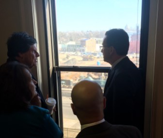 Gov. Dannel P. Malloy and Rep. Buddy Altobello looking out on the site of a Meriden rail, park and flood-control project.